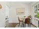 Bright dining area features modern decor, wood floors, and a sunny window, perfect for enjoying meals at 826 Garden Plz, Orlando, FL 32803