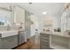 An angled view of the open kitchen flows to the dining area and features wood floors and an open design at 826 Garden Plz, Orlando, FL 32803