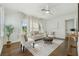 Comfortable living room with hardwood floors, neutral furniture, and bright natural light at 826 Garden Plz, Orlando, FL 32803