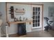 Home bar area featuring a wine rack, glass storage, and a mini-refrigerator at 833 Channing Rd, Lakeland, FL 33805