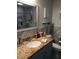 Bathroom with a modern sink, granite countertops, and decorative tile at 833 Channing Rd, Lakeland, FL 33805