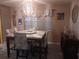 Dining room featuring stylish chairs, a modern light fixture, and natural light at 833 Channing Rd, Lakeland, FL 33805