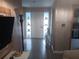 Foyer view with light fixtures and tile flooring at 833 Channing Rd, Lakeland, FL 33805