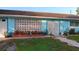 Charming single-story home with a baby blue exterior, mature landscaping, and a walkway leading to the front door at 833 Channing Rd, Lakeland, FL 33805