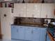 Charming kitchen with butcher block countertops and two-tone cabinets at 833 Channing Rd, Lakeland, FL 33805