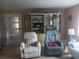 Living room showcasing comfortable recliner chairs and a decorative curio cabinet at 833 Channing Rd, Lakeland, FL 33805