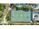 Overhead view of a well-maintained basketball court and surrounding landscaping at 8901 Rhodes St, Kissimmee, FL 34747