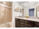 A beautifully designed bathroom with a walk-in shower and modern vanity at 8901 Rhodes St, Kissimmee, FL 34747