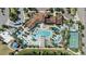 Beautiful aerial view of a community with resort-style pool, clubhouse and recreation areas at 8901 Rhodes St, Kissimmee, FL 34747