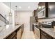 Well-equipped kitchen with granite countertops and stainless steel appliances at 8901 Rhodes St, Kissimmee, FL 34747