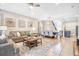 Spacious living and dining area with neutral tones, stylish furnishings, and tile flooring at 8901 Rhodes St, Kissimmee, FL 34747