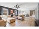 Spacious living room with modern furnishings and decor with an adjoining dining area at 8901 Rhodes St, Kissimmee, FL 34747