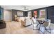 Open-concept living space with comfortable seating, modern lighting, and stylish decor at 8901 Rhodes St, Kissimmee, FL 34747