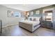 This main bedroom features stylish decor, a large bed, and plenty of natural light at 8901 Rhodes St, Kissimmee, FL 34747