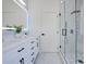 This bathroom features a double vanity, marble floors, and a glass-enclosed shower at 912 Pickfair Ter, Lake Mary, FL 32746