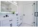 Well-lit bathroom with updated vanity, marble floors, and a modern glass shower at 912 Pickfair Ter, Lake Mary, FL 32746