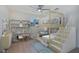 Charming bedroom with a unique bunk bed, shelving, and plenty of space for play at 912 Pickfair Ter, Lake Mary, FL 32746