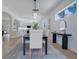 Bright dining room leads to modern kitchen with island and stainless appliances at 912 Pickfair Ter, Lake Mary, FL 32746