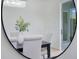 Modern dining room featuring stylish chairs, a glass door, and a crystal chandelier at 912 Pickfair Ter, Lake Mary, FL 32746