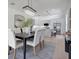 Bright dining room leads to kitchen with island and modern cabinetry and appliances at 912 Pickfair Ter, Lake Mary, FL 32746