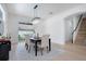 Bright dining room featuring a modern chandelier, table with seating for six, and view to backyard at 912 Pickfair Ter, Lake Mary, FL 32746