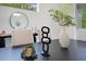 Close up of dining table with contemporary sculpture and decor at 912 Pickfair Ter, Lake Mary, FL 32746