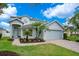 Charming two-story home with landscaped yard and a two-car garage at 912 Pickfair Ter, Lake Mary, FL 32746