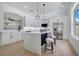 Modern kitchen featuring stainless steel appliances and a large center island at 912 Pickfair Ter, Lake Mary, FL 32746