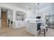 Stylish kitchen featuring modern appliances, quartz countertops, and a spacious island with seating at 912 Pickfair Ter, Lake Mary, FL 32746