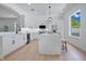 Modern kitchen featuring stainless steel appliances and a large center island at 912 Pickfair Ter, Lake Mary, FL 32746
