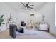 Bright living room featuring modern decor, stylish furniture, and a ceiling fan at 912 Pickfair Ter, Lake Mary, FL 32746