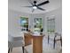 Bright office space with lots of natural light, hardwood floors, and modern furniture at 912 Pickfair Ter, Lake Mary, FL 32746