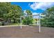 Park swing set with lake views surrounded by mulch, beautiful trees and manicured lawn at 912 Pickfair Ter, Lake Mary, FL 32746