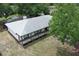 An aerial view showing the property's backyard, screened-in pool, and landscaping at 9551 Lake Douglas Pl, Orlando, FL 32817