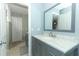Bathroom features marble countertop vanity and ample lighting at 9551 Lake Douglas Pl, Orlando, FL 32817