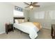 Cozy bedroom with ceiling fan and warm neutral décor at 9551 Lake Douglas Pl, Orlando, FL 32817
