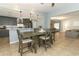 Open-concept dining area with bar seating, kitchen view, and a connection to the living room, perfect for entertaining at 9551 Lake Douglas Pl, Orlando, FL 32817