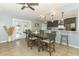 Elegant dining area with stylish furnishings, a view of the kitchen, and abundant natural light for enjoyable gatherings at 9551 Lake Douglas Pl, Orlando, FL 32817