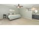 Bright main bedroom with ceiling fan and neutral décor at 9551 Lake Douglas Pl, Orlando, FL 32817