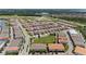 Expansive aerial view showcasing this community's many homes, streets, and green common area at 10072 Sunnifa Aly, Orlando, FL 32832