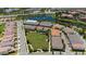 Beautiful aerial view of a home in a Primary-planned community with a lake and well-manicured green spaces at 10072 Sunnifa Aly, Orlando, FL 32832