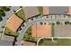 Aerial view of a neighborhood with tile roofs and tree lined streets at 10072 Sunnifa Aly, Orlando, FL 32832