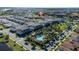 Wide aerial shows this community with the community pool, park and multiple units at 10072 Sunnifa Aly, Orlando, FL 32832