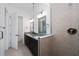 Stylish bathroom featuring dual sinks, granite countertop, framed mirrors, and a glass shower at 10072 Sunnifa Aly, Orlando, FL 32832