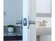 Modern bathroom featuring a pedestal sink with brushed nickel hardware and granite countertop at 10072 Sunnifa Aly, Orlando, FL 32832