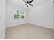 Spacious bedroom with a ceiling fan and tile flooring at 10072 Sunnifa Aly, Orlando, FL 32832