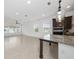 Bright and airy living room and kitchen with large windows and modern finishes at 10072 Sunnifa Aly, Orlando, FL 32832
