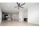 Open-concept living area with modern lighting, a stylish ceiling fan, and a convenient built-in desk at 10072 Sunnifa Aly, Orlando, FL 32832
