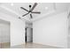 Spacious main bedroom with a tray ceiling, ceiling fan, and a walk-in closet for ample storage at 10072 Sunnifa Aly, Orlando, FL 32832