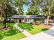 Charming one-story home with a well-manicured lawn and mature trees at 105 Laurel Oak Dr, Longwood, FL 32779